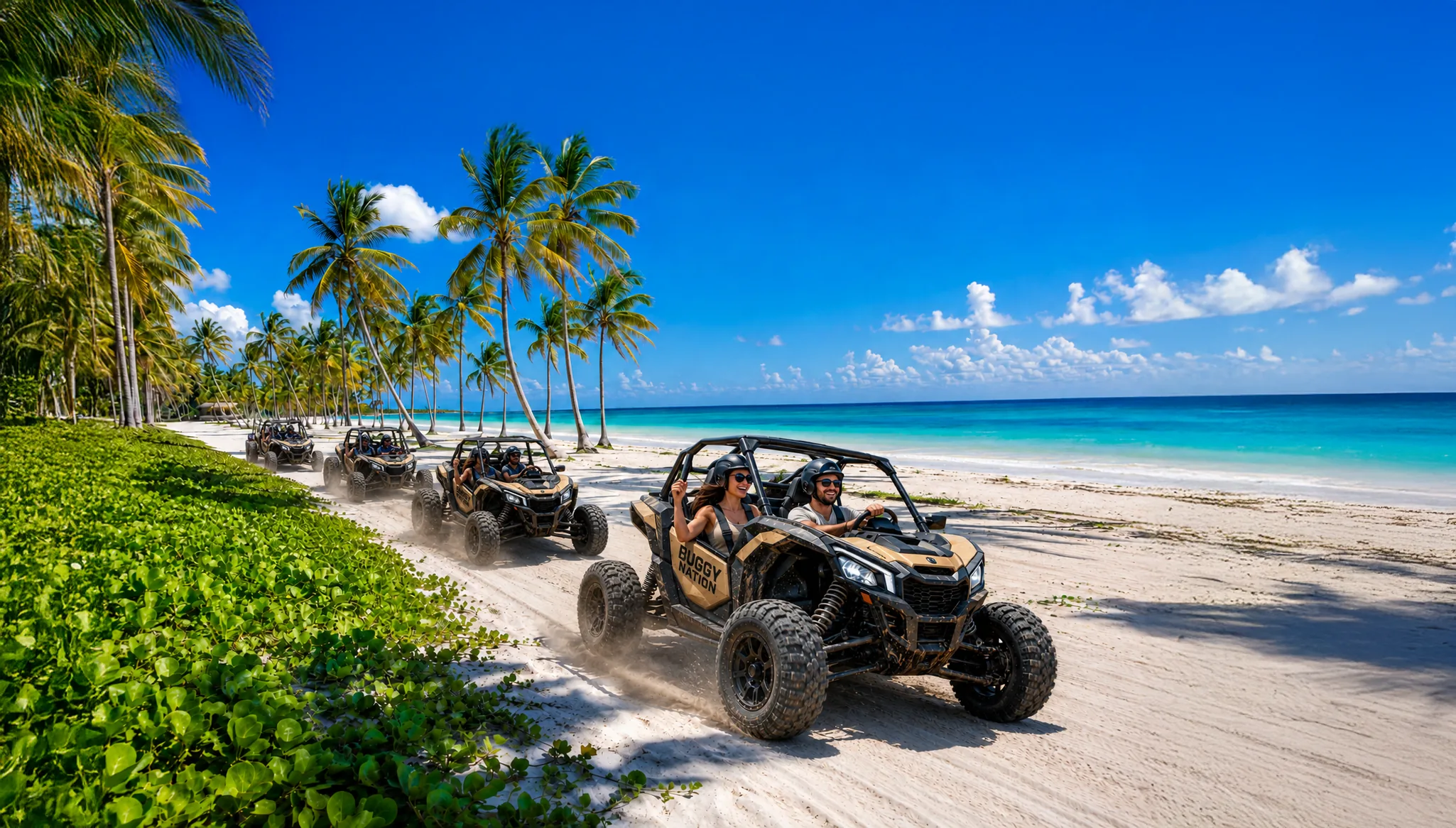 A convoy of Buggy Nation vehicles cruising along a palm-lined Caribbean beach.